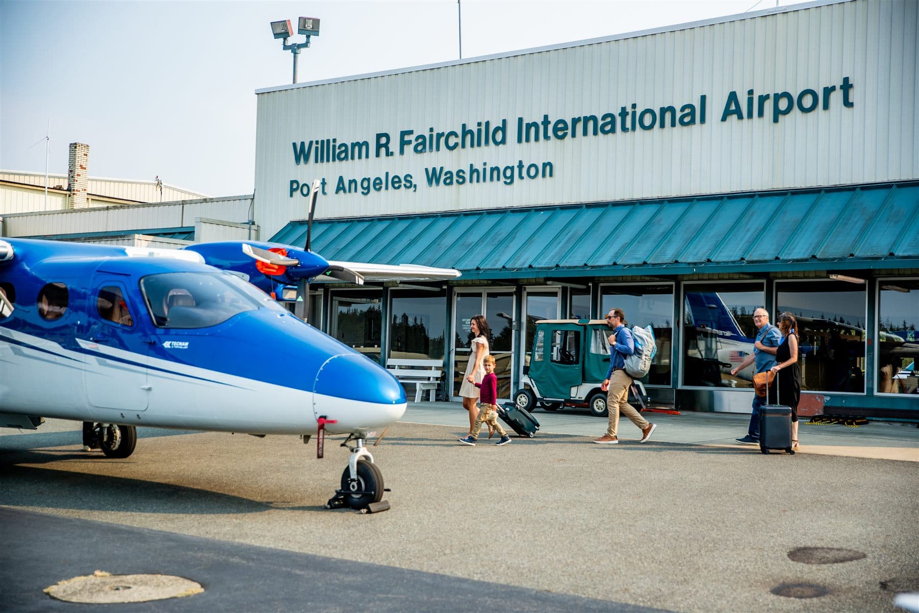Passengers meeting their pilot at the Citizen Air desk inside the Fairchild terminal